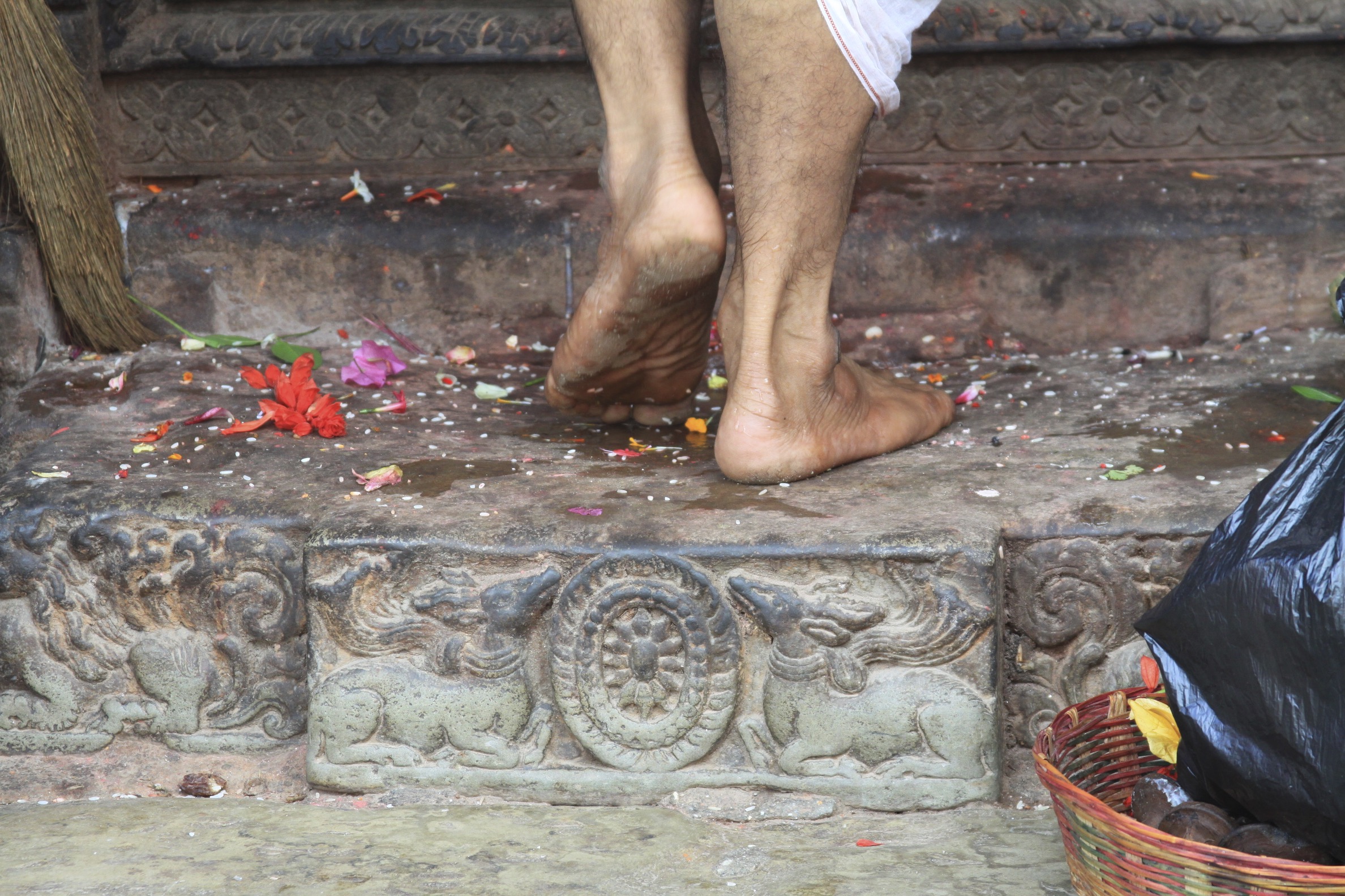 A hindu priest walking into the Temple